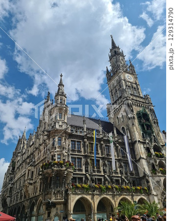 Munich, Germany - July 27, 2025: Facade of the Cathedral Church of Our Lady, Frauenkirche, Munich's most famous church and its two towers are landmarks of the city 129314790