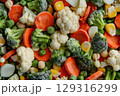 Close-up of assorted frozen vegetables including broccoli, carrots, corn, and cauliflower 129316299