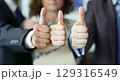 Success resonates in a business meeting as participants celebrate achievements with enthusiastic gestures of approval and teamwork 129316549