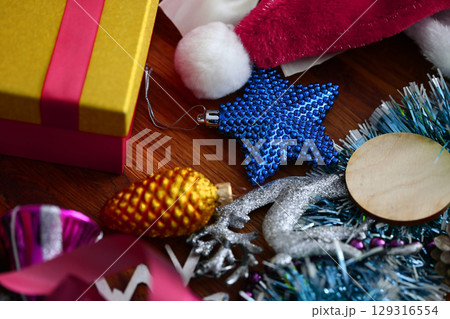 Festive decorations and colorful gifts create a vibrant holiday atmosphere for celebration and joy in cheerful surroundings Festive decorations and colorful gifts create a vibrant holiday atmosphere for celebration and joy in cheerful surroundings 129316554