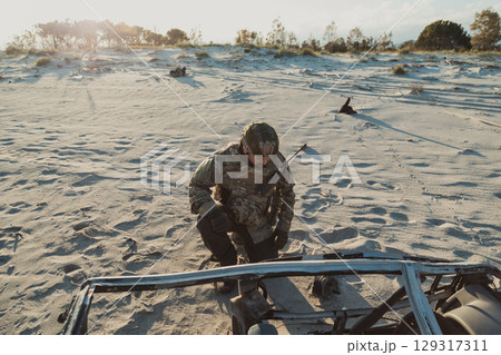 MIlitary Contractor On His Knees At The Beach  129317311