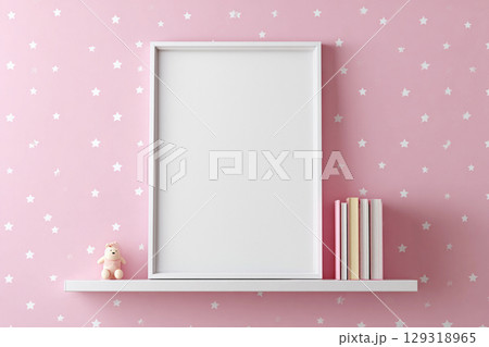 Blank frame for wall art mockup in a modern nursery with pastel pink walls and a wooden shelf featuring books and a soft toy 129318965