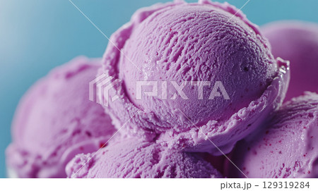 Purple ice cream delight served in a bowl, perfect for summer treats at a sunny afternoon gathering with friends or family Purple ice cream delight served in a bowl, perfect for summer treats at a sunny afternoon gathering with friends or family 129319284