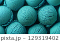 Beautifully arranged scoops of emerald green ice cream ready to be served. Summer background. 129319402