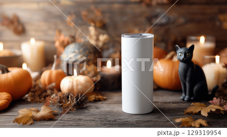 Mockup of plain white tumbler on Halloween theme background with copy space for text, warm rustic orange color tone. 129319954