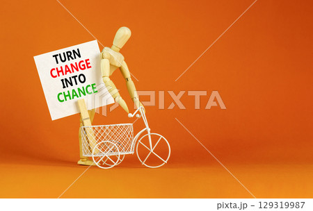 Turn change into chance symbol. Concept words phrase Turn change into chance on beautiful white paper on clothespin. Beautiful orange background. Business Turn change into chance concept. Copy space. Turn change into chance symbol. Concept words phrase Turn change into chance on beautiful white paper on clothespin. Beautiful orange background. Business Turn change into chance concept. Copy space. 129319987
