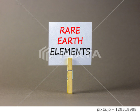 Rare earth elements symbol. Concept words Rare earth elements on beautiful white paper on wooden clothespin. Beautiful grey background. Business and rare earth elements concept. Copy space. Rare earth elements symbol. Concept words Rare earth elements on beautiful white paper on wooden clothespin. Beautiful grey background. Business and rare earth elements concept. Copy space. 129319989