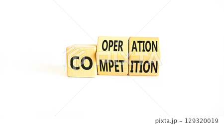 Competition or cooperation symbol. Concept word Competition or Cooperation on wooden cubes. Beautiful white table white background. Business Competition or cooperation concept. Copy space. 129320019