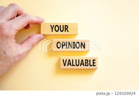 Your opinion valuable symbol. Concept words Your opinion valuable on beautiful wooden blocks. Beautiful white background. Businessman hand. Business your opinion valuable concept. Copy space. Your opinion valuable symbol. Concept words Your opinion valuable on beautiful wooden blocks. Beautiful white background. Businessman hand. Business your opinion valuable concept. Copy space. 129320024