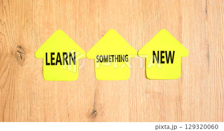 Learn something new symbol. Concept words Learn something new on beautiful yellow paper houses. Beautiful wooden background. Business motivational lifestyle learn something new concept. Copy space. Learn something new symbol. Concept words Learn something new on beautiful yellow paper houses. Beautiful wooden background. Business motivational lifestyle learn something new concept. Copy space. 129320060