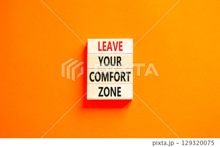 Leave your comfort zone symbol. Concept words Leave your comfort zone on beautiful wooden blocks. Beautiful orange paper background. Business psychological Leave your comfort zone concept. Copy space. Leave your comfort zone symbol. Concept words Leave your comfort zone on beautiful wooden blocks. Beautiful orange paper background. Business psychological Leave your comfort zone concept. Copy space. 129320075