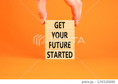 Get your future started symbol. Concept words Get your future started on beautiful wooden blocks. Beautiful orange table orange background. Business get your future started concept. Copy space. 129320080