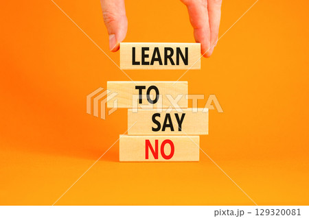 Learn to say no symbol. Concept words phrase Learn to say no on beautiful wooden blocks. Beautiful orange paper background. Businessman's hand Business psychological Learn to say no concept Copy space Learn to say no symbol. Concept words phrase Learn to say no on beautiful wooden blocks. Beautiful orange paper background. Businessman's hand Business psychological Learn to say no concept Copy space 129320081