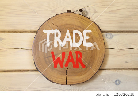 Trade war symbol. Concept word Trade war on beautiful wooden circle on wooden wall. Beautiful wooden wall background. Business trade war concept. Copy space. Trade war symbol. Concept word Trade war on beautiful wooden circle on wooden wall. Beautiful wooden wall background. Business trade war concept. Copy space. 129320219