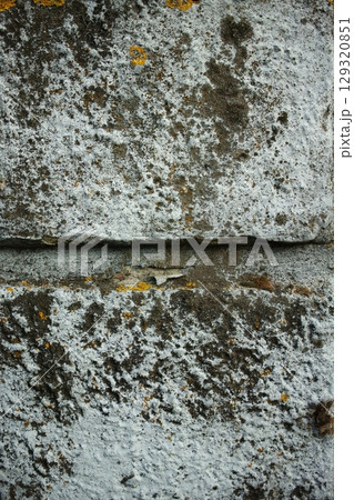 A wall with a grey and white surface. Vertical composition ideal for phone wallpaper or minimal nature backgrounds. A wall with a grey and white surface. Vertical composition ideal for phone wallpaper or minimal nature backgrounds. 129320851