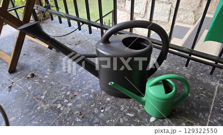Gardening essentials: pair of watering cans for home and outdoor use 129322550