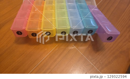 Weekly pill organizer with seven compartments for daily medication management. Pill boxes 129322594