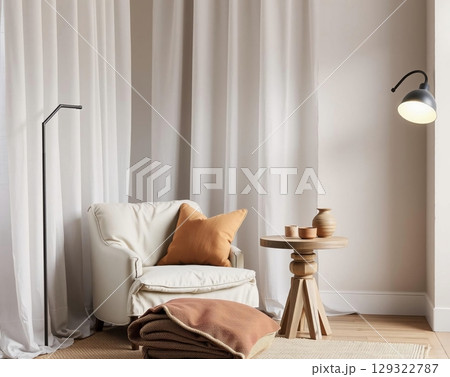 Cozy living room with armchair, blanket, lamp, side table 129322787