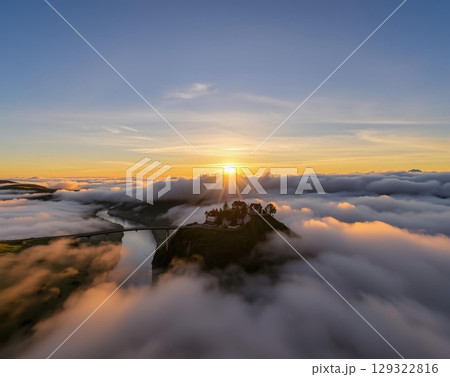 Golden Hour Serenity: A Misty Mountain Village Embrace 129322816