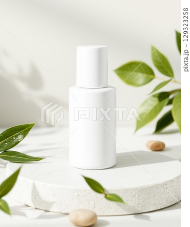 Minimalist White Cosmetic Bottle with Natural Green Foliage 129323258