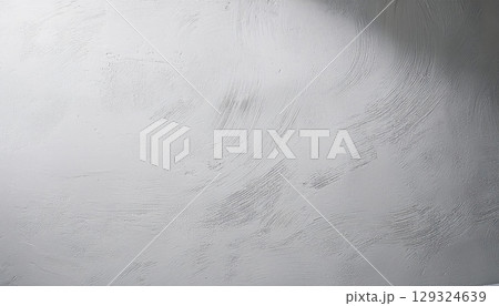 Textured concrete surface with subtle patterns and shadows, creating serene atmosphere Textured concrete surface with subtle patterns and shadows, creating serene atmosphere 129324639