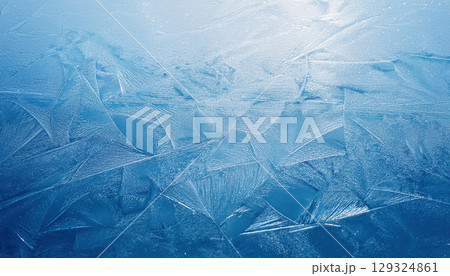 Textured ice surface with natural scratches showcasing cool winter palette 129324861