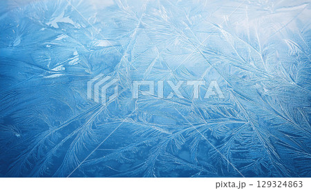 Textured ice surface with natural scratches showcasing cool winter palette 129324863