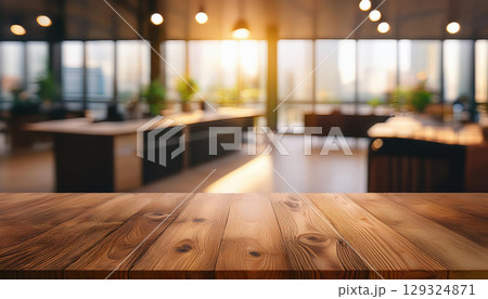 Modern office interior with wooden tabletop and warm lighting ambiance Modern office interior with wooden tabletop and warm lighting ambiance 129324871
