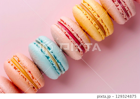 Colorful French Macarons on Pink Background 129324875