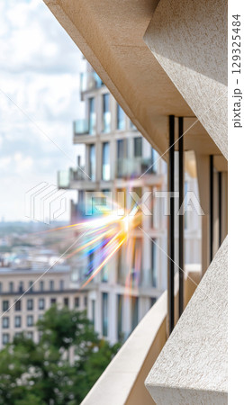 Urban architecture with geometric facades and sunlight reflection in modern cityscape 129325484