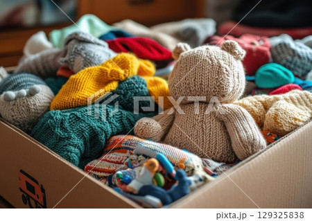 Knitted toys in donation box. Knitted toys in donation box. 129325838