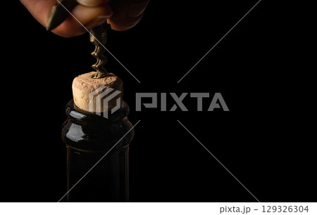 Bottle of wine with corkscrew 129326304