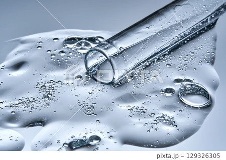 A test tube with spilled serum. Demonstration of the texture. 129326305