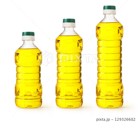 Three plastic bottles of vegetable oil of different sizes on white background Three plastic bottles of vegetable oil of different sizes on white background 129326682