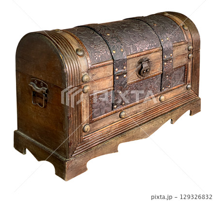 Closed wooden hope chest displaying floral metal decoration and rivets 129326832