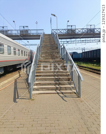 Concrete stairway in an industrial style in gray and blue colors representing travel and public transport with copy space Concrete stairway in an industrial style in gray and blue colors representing travel and public transport with copy space 129327413