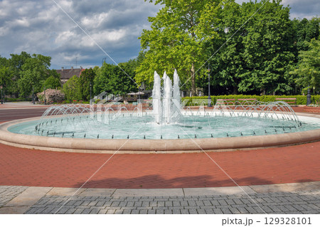 Beautiful fountain with water jets in city park Nagykanizsa, Hungary. Beautiful fountain with water jets in city park Nagykanizsa, Hungary. 129328101