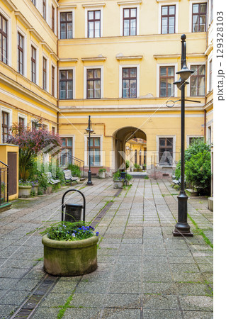 Quiet courtyard in historic yellow building. Nagykanizsa, Hungary. 129328103