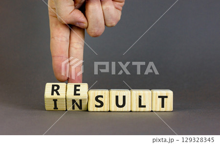 Result or insult symbol. Concept words Result Insult on wooden cubes. Beautiful grey table grey background. Businessman hand. Business and result or insult concept. Copy space. 129328345