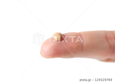 Makeup artist demonstrating foundation swatch on fingertip, product sample isolated on transparent background Makeup artist demonstrating foundation swatch on fingertip, product sample isolated on transparent background 129329769