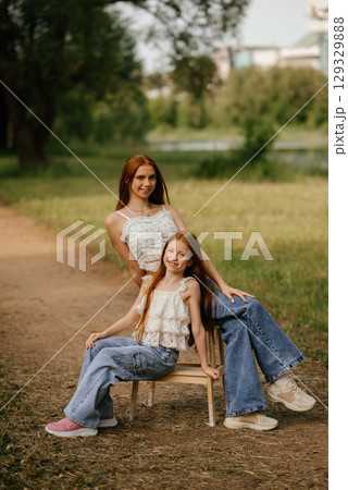 Smiling Siblings Enjoying Outdoor Walk Together Smiling Siblings Enjoying Outdoor Walk Together 129329888