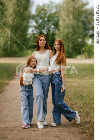 Family Stroll in Park with Two Daughters 129329921