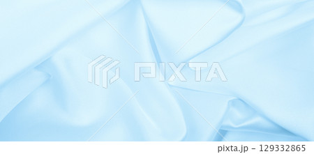 Smooth elegant blue silk or satin luxury cloth texture as abstract background. Luxurious background design 129332865