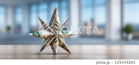 Dollar business concept with origami star made from money on wooden table in modern office space 129334805