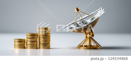 Dollar business concept with stacked gold coin and satellite dish holding dollar bills symbolizing financial growth and communication 129334868