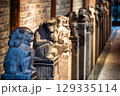 Ancient stone sculptures in DuJiangYan featuring various animal 129335114