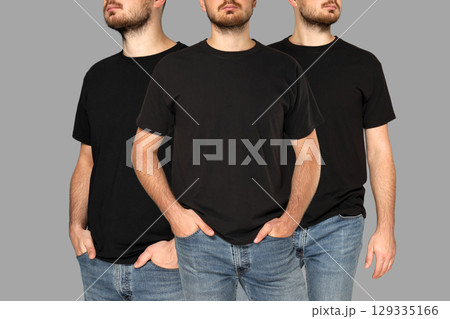 Man showcases modern black t-shirt in casual poses with jeans Man showcases modern black t-shirt in casual poses with jeans 129335166