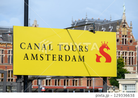 Canal tours Amsterdam, popular tourist sightseeing of old town Amsterdam with its iconic canals, in Amsterdam, Netherlands 129336638