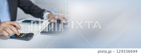 Businessman using laptop for analytics, finance and banking technology. Businessman using laptop for analytics, finance and banking technology. 129336694
