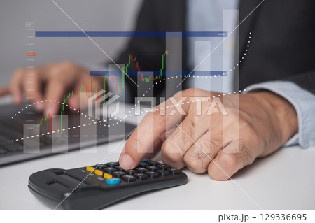 Closeup businessman hand doing finances and calculate on desk, Closeup businessman hand doing finances and calculate on desk, 129336695